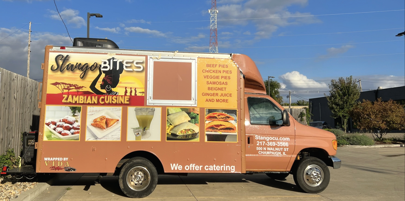 Stango Bites food truck exterior showing the Zambian Cuisine menu wrap